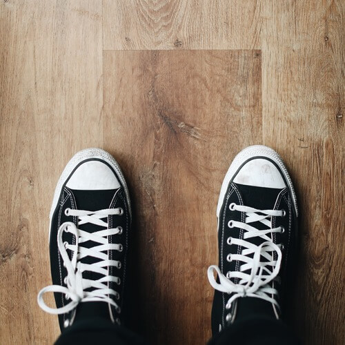 sneakers on hardwood flooring