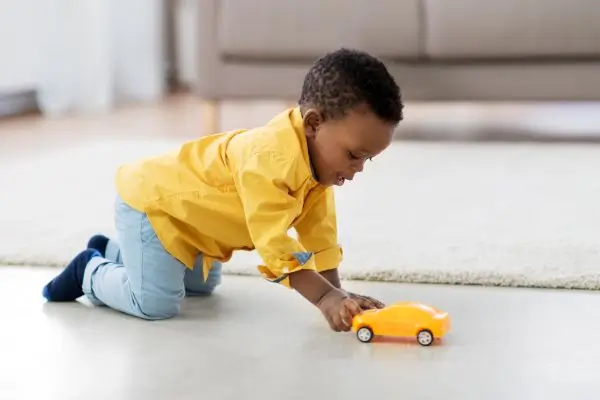 toddler playing on floor