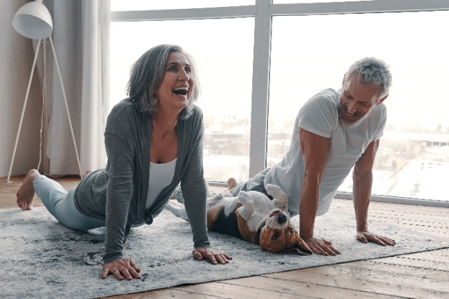 seniors doing yoga on a rug