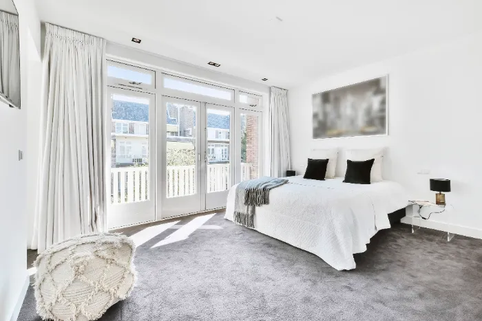 modern bedroom with gray carpet