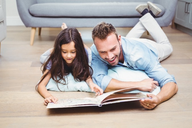 father and daughter on hardwood floor