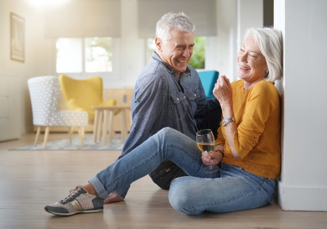 seniors sitting on a hardwood floor